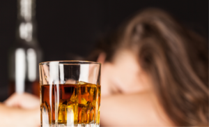 A woman fell asleep after drinking to much alcohol.